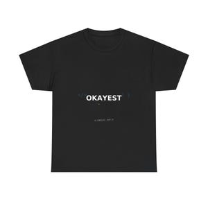 May include: A black short-sleeved t-shirt featuring the white text OKAYEST centered on the chest. The design includes blue and white coding brackets and symbols surrounding the word, with the smaller text IT COMPILES, SHIP IT below.