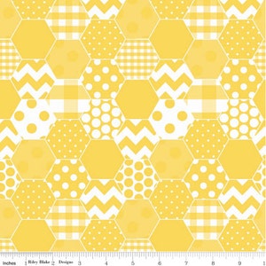 May include: Yellow and white patterned fabric with a honeycomb design. The fabric features various patterns within the hexagons, including polka dots, gingham, and chevron stripes. The design is by Riley Blake Designs.