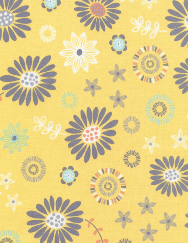May include: A yellow fabric with a repeating floral pattern. The design features large gray daisies, white and blue flowers, and smaller star-shaped flowers. The flowers have orange, blue, and gray centers. The background is a solid yellow.