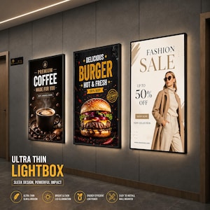 May include: Three rectangular, wall-mounted, ultra-thin LED lightboxes with black frames. The left displays coffee, the center a burger, and the right a fashion sale advertisement. Each sign features bright, even illumination and a sleek design.