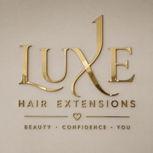 May include: A gold-colored wall sign featuring the word LUXE in large, stylized lettering. Below it, the text reads HAIR EXTENSIONS, followed by a small heart icon, and the words BEAUTY, CONFIDENCE, YOU, all in a matching gold finish.