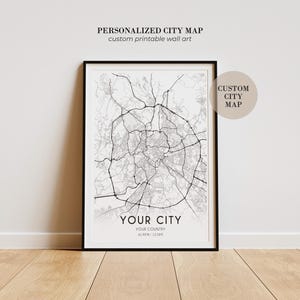 May include: A framed wall art print featuring a black and white city map with intricate road networks. The text reads PERSONALIZED CITY MAP, custom printable wall art, CUSTOM CITY MAP, YOUR CITY, YOUR COUNTRY, and coordinates 41.90N | 12.50E.