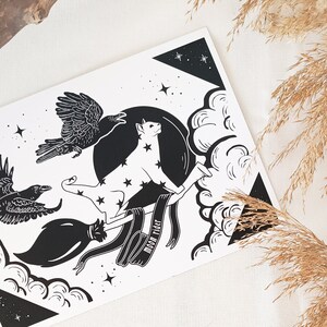 May include: Black and white illustration of a cat riding a broom with two ravens flying behind it. The cat is wearing a crown and the broom has the text "Moon Rider" on it.