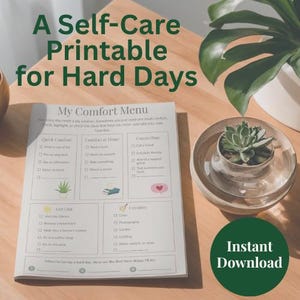 May include: A white paper sheet titled My Comfort Menu featuring sections for Quick Comfort, Comfort at Home, Connection, Get Out, and Creative activities with checkboxes and small illustrations, plus the text A Self-Care Printable for Hard Days.