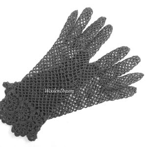 May include: A pair of black crocheted gloves with a delicate lace pattern at the wrist.