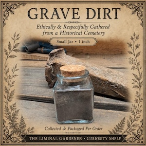 May include: A small square glass jar filled with dark soil, topped with a cork stopper. The label reads GRAVE DIRT, Ethically & Respectfully Gathered from a Historical Cemetery, Small Jar, 1 inch, Collected & Packaged Per Order, THE LIMINAL GARDENER, CURIOSITY SHELF.