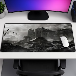 May include: A rectangular mouse mat with a black and white image of a ruined city. The design shows a destroyed building and rubble. A white computer mouse is positioned on the right side of the mat.