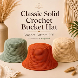 May include: Three crochet bucket hats in sage green, burnt orange, and cream. The text reads: Classic Solid Crochet Bucket Hat, Crochet Pattern PDF, 3 Colorways, Beginner. The hats feature a dense, uniform stitch pattern with a flat top and brim.