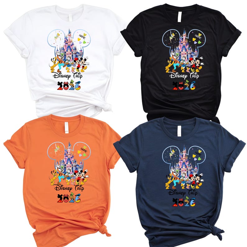 May include: Four short-sleeve t-shirts in white, black, orange, and navy blue. Each features a graphic of a castle inside a Mickey Mouse silhouette, surrounded by cartoon characters, the text "Disney Trip 2026", and a space for a name.
