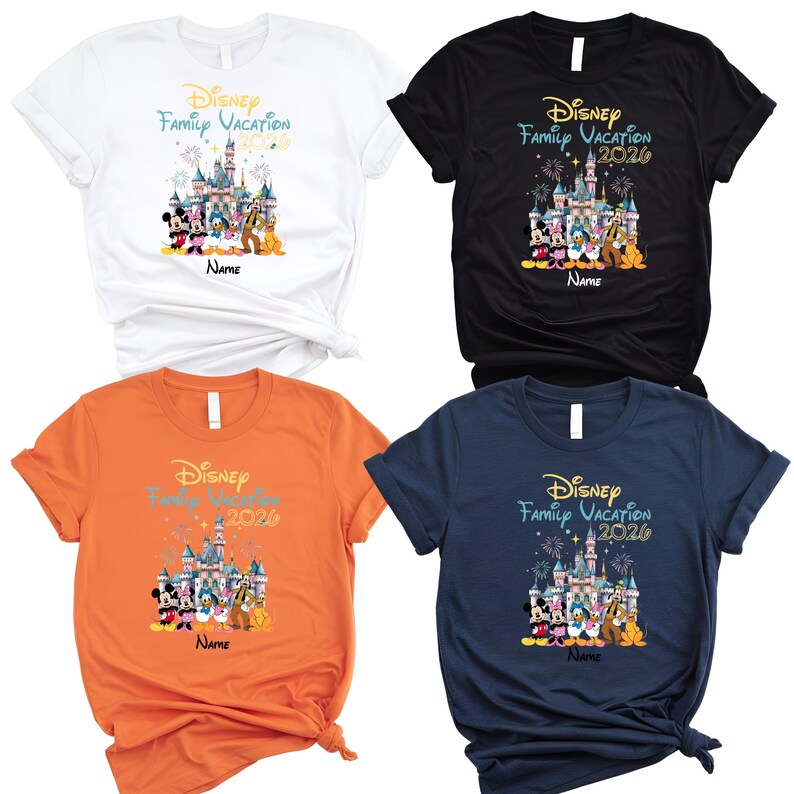 May include: Four short-sleeved t-shirts in white, black, orange, and navy blue. Each shirt features a graphic of a castle, fireworks, and Disney characters with the text Disney Family Vacation 2026 and a placeholder for a name below the design.