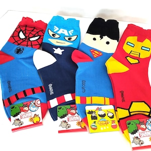 May include: A set of three ceramic mugs with a speckled, matte finish. Each mug features a different color: light blue, cream, and gray. The mugs have a simple, modern design and a comfortable handle.