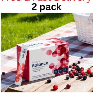 Pode incluir: Um pacote de 2 caixas de suplemento alimentar Unicity Balance sabor frutas vermelhas e sach&ecirc;s individuais. A embalagem branca apresenta um padr&atilde;o de c&iacute;rculos vermelhos e rosas, o texto "Unicity Balance" e os r&oacute;tulos "4g", "0g" e "90".