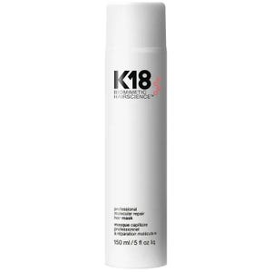 May include: A white cylindrical bottle of K18 Biomimetic Hairscience professional molecular repair hair mask. The label features black text and a small red circular graphic. The bottle contains 150 ml or 5 fl oz liq of product.
