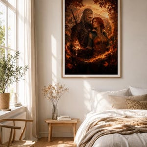 May include: A framed wall art print depicting a fantasy scene with a long-haired man carrying a sword and a woman with red hair standing together, surrounded by a swirling ring of orange fire and autumn leaves in a dark, atmospheric forest setting.
