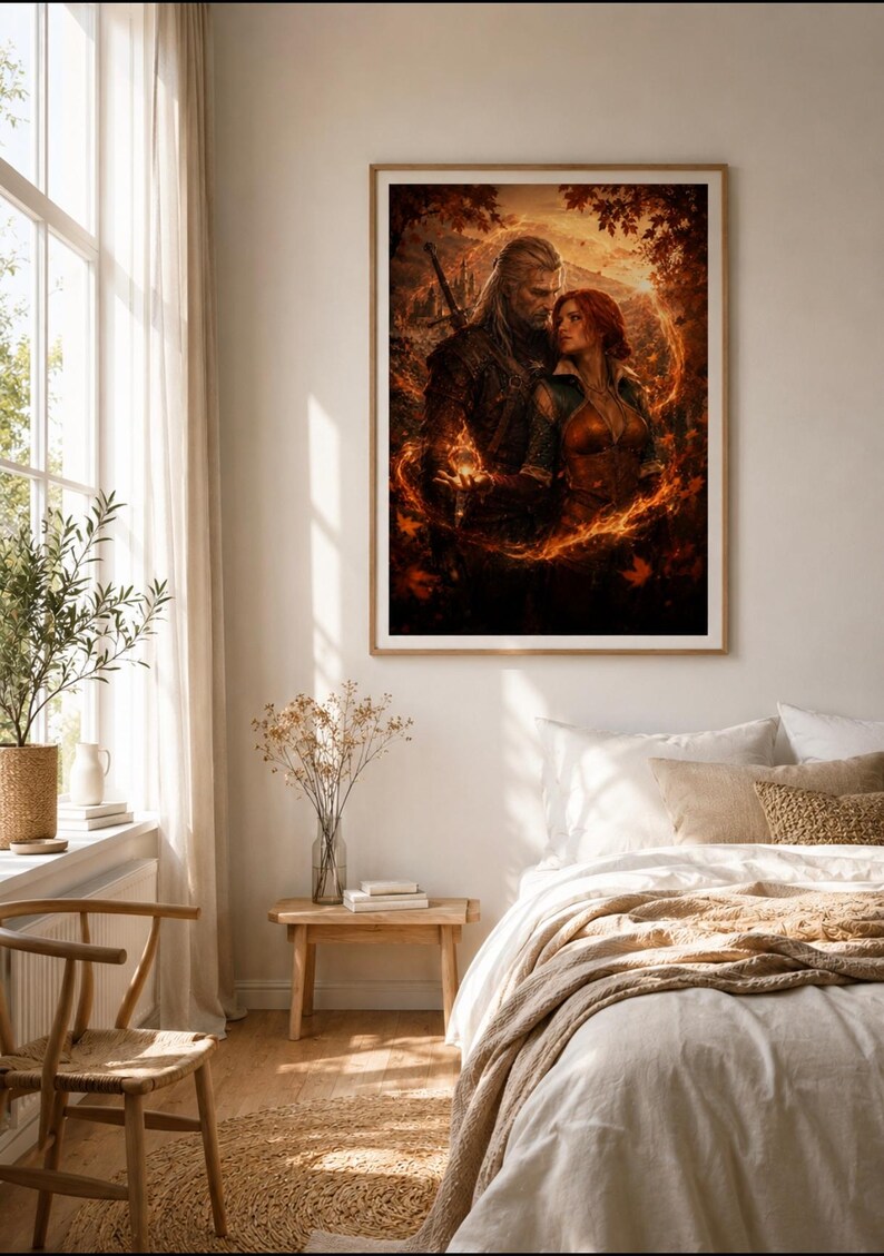 May include: A framed wall art print depicting a fantasy scene with a long-haired man carrying a sword and a woman with red hair standing together, surrounded by a swirling ring of orange fire and autumn leaves in a dark, atmospheric forest setting.