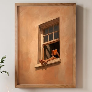 May include: A framed wall art print featuring a painting of a person sitting in a window frame reading an orange book. The scene depicts a textured, light brown wall with a wooden window frame, showing the person's feet and hands holding the book.