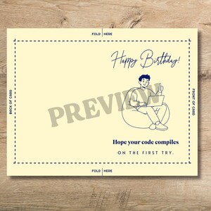 May include: A pale yellow greeting card template featuring a dark blue line drawing of a person sitting in a beanbag chair using a laptop with a thumbs up. Text reads Happy Birthday! and Hope your code compiles ON THE FIRST TRY. Includes fold lines.