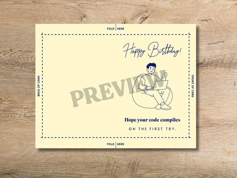 May include: A pale yellow greeting card template featuring a dark blue line drawing of a person sitting in a beanbag chair using a laptop with a thumbs up. Text reads Happy Birthday! and Hope your code compiles ON THE FIRST TRY. Includes fold lines.