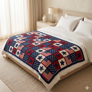 May include: A crocheted blanket with a patriotic design. The blanket features a patchwork pattern of red, white, and blue squares. Some squares display American flags, while others showcase stars. The blanket is draped over a bed.