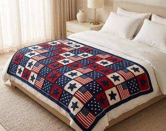 May include: A crocheted blanket with a patriotic design. The blanket features a patchwork pattern of red, white, and blue squares. Some squares display American flags, while others showcase stars. The blanket is draped over a bed.