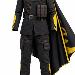 May include: A black and yellow tactical costume featuring a long-sleeved jacket with yellow shoulder panels, a dark cowl, and a matching cape. The outfit includes a utility belt with pouches, a diagonal chest strap, and black trousers with yellow accents.