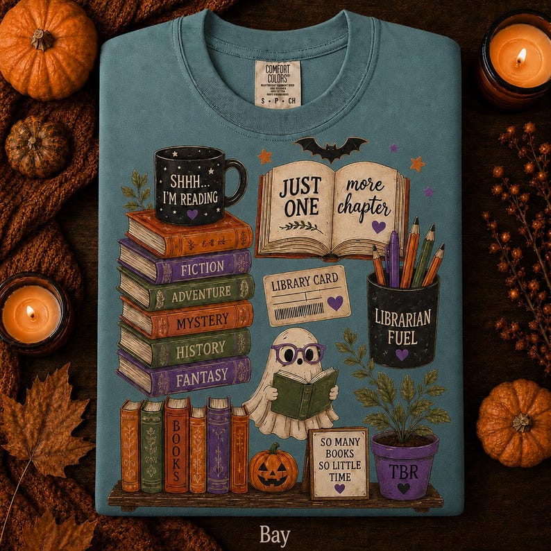 May include: A blue t-shirt featuring a graphic print of a stack of books labeled Fiction, Adventure, Mystery, History, and Fantasy, a ghost reading a book, a mug labeled Shhh I'm Reading, a pencil holder labeled Librarian Fuel, and text reading Just One More Chapter, Library Card, and So Many Books So Little Time.