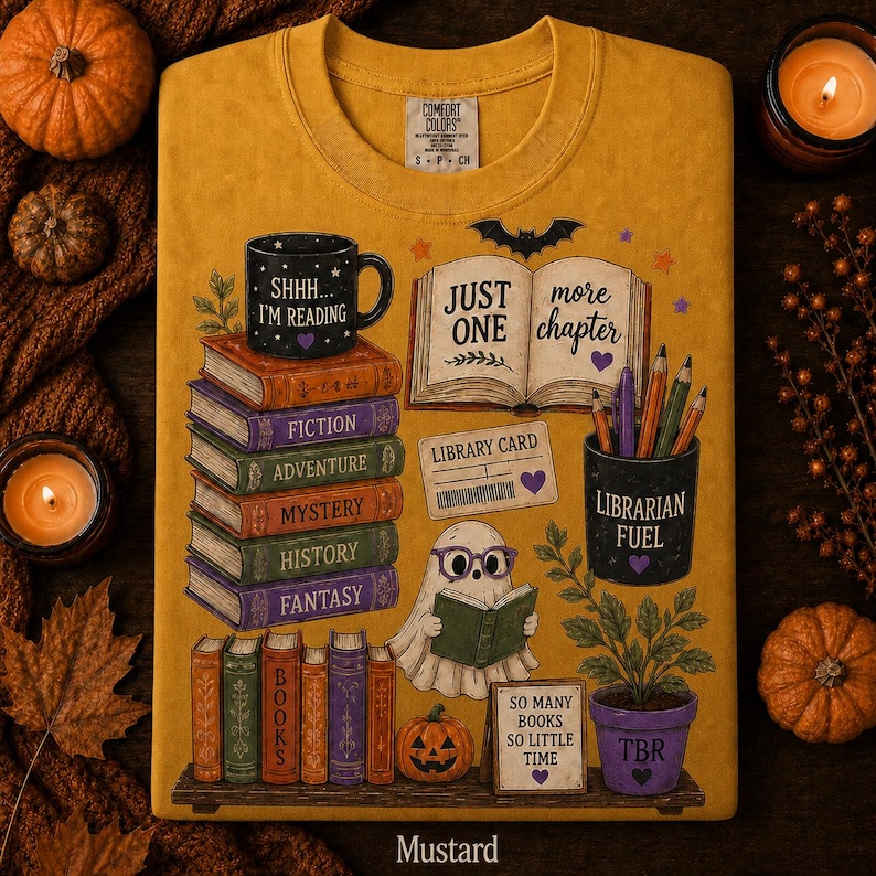 May include: A mustard yellow t-shirt featuring a graphic print of a stack of books labeled Fiction, Adventure, Mystery, History, and Fantasy. It includes a ghost reading a book, a mug labeled Shhh... I'm Reading, and a pencil holder labeled Librarian Fuel.