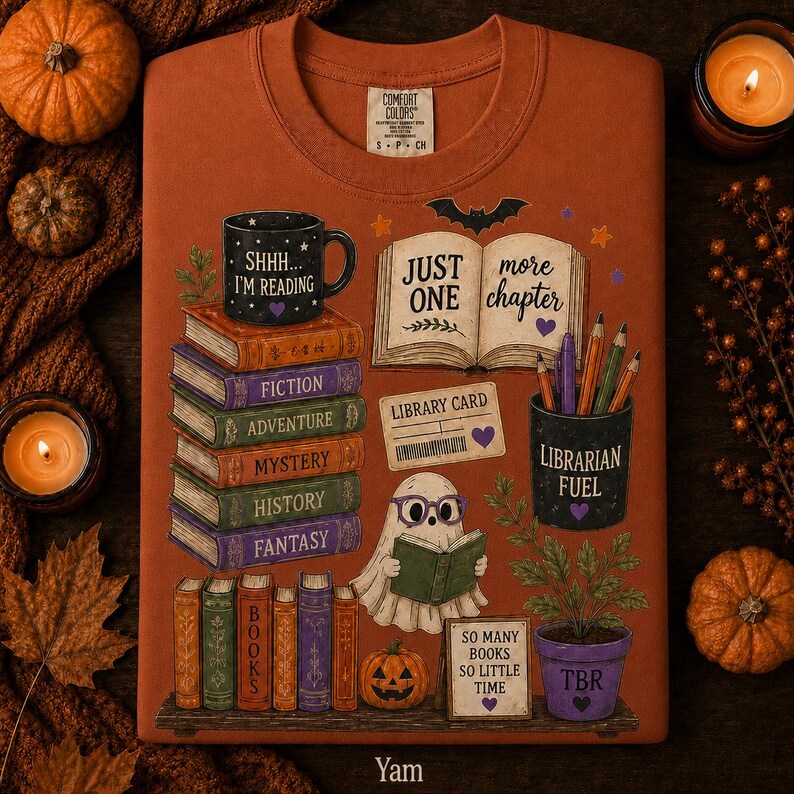 May include: A rust-colored t-shirt featuring a graphic print of a stack of books labeled Fiction, Adventure, Mystery, History, and Fantasy. A ghost wearing purple glasses reads a book next to a mug that says SHHH... I'M READING and a pencil holder.