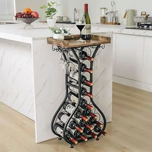 May include: A black metal wine rack with a wooden top shelf, designed to hold multiple wine bottles in a curved, hourglass-shaped frame. The rack features integrated hanging glass holders at the top and a sturdy base, providing storage for wine bottles.