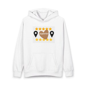May include: A white hooded sweatshirt featuring a central graphic with a brown heart containing the word superior in white text. The design is flanked by two black location pins and bordered by five yellow stars above and five yellow stars below.