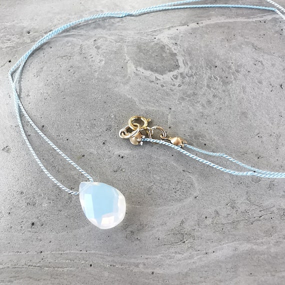 Delicate opal necklace with faceted opal pendant, gold filled clasp, fine silk thread