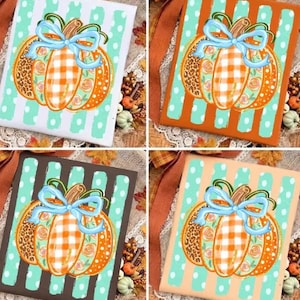May include: Four square decorative signs featuring a central pumpkin illustration with a light blue bow. The pumpkin has sections of orange gingham, leopard print, and floral patterns. Each sign has a different background color: white, orange, brown, and tan.