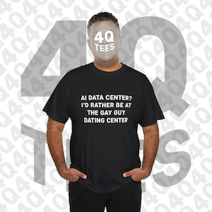 May include: A black short-sleeved t-shirt featuring white text that reads: AI DATA CENTER? I'D RATHER BE AT THE GAY GUY DATING CENTER. The shirt has a crew neckline and a standard fit, presented against a background with a repeating 4Q TEES watermark.