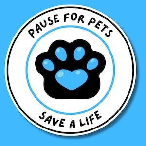 May include: A circular sticker with a white background and a thin blue border. In the center is a black paw print with a bright blue heart-shaped pad. The text PAUSE FOR PETS is arched above, and SAVE A LIFE is arched below in black lettering.