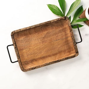 May include: A rectangular wooden serving tray with a rustic bark-like edge and black metal handles.
