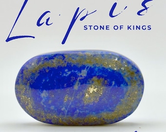 May include: A polished oval lapis lazuli stone with deep blue colouring and gold-coloured pyrite inclusions. The text "Lapis" and "Lazuli" appears in large blue script, with "STONE OF KINGS" and "ENERGETIC ALLIES" printed in smaller text.