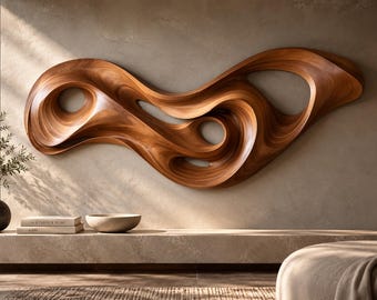 May include: A large, horizontal wall sculpture crafted from polished brown wood, featuring fluid, organic, and swirling curves with multiple hollow openings. The piece displays a rich, natural wood grain pattern and a smooth, glossy finish.