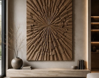 May include: A large rectangular wall art piece featuring a deep brown, carved wood texture with a radial sunburst pattern. The artwork is mounted above a long, low, light-colored stone console table, creating a focal point in the room.