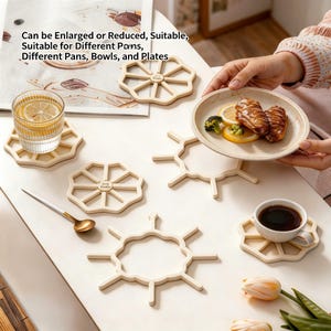 May include: Several beige, geometric coasters are arranged on a white table. A glass of water with lemon, a cup of coffee, and a plate of food are also present. The image includes the text: "Can be Enlarged or Reduced, Suitable, Suitable for Different Pans, Bowls, and Plates."