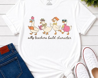 Silly Teachers Build Character Shirt, Funny Duck Teacher Tee, Educator Humor Gift, Back to School Staff Appreciation, Unisex T-Shirt