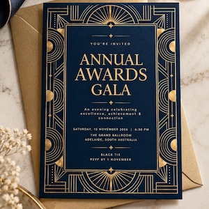 Könnte beinhalten: Eine marineblaue Einladungskarte mit geometrischen Goldfolienrändern und dem Text: YOU'RE INVITED ANNUAL AWARDS GALA, An evening celebrating excellence, achievement & connection, SATURDAY, 15 NOVEMBER 2026 | 6:30 PM, THE GRAND BALLROOM, ADELAIDE, SOUTH AUSTRALIA, BLACK TIE, RSVP BY 1 NOVEMBER.