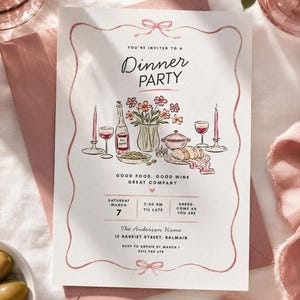 Puede incluir: Una tarjeta de invitación blanca para una cena con un borde de cinta de acuarela rosa y una ilustración central de una mesa puesta con flores, vino y pan. El texto dice: You're invited to a Dinner Party, Good Food, Good Wine, Great Company, Saturday March 7, 7:00 PM til late, Dress: Come as you are, The Anderson Home, 12 Harriet Street, Balmain, RSVP to Sophie by March 1, 0412 345 678.