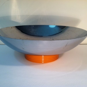 Chrome Bowl With Carved Butterscotch Bakelite Pedestal Base.