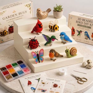 May include: A DIY beaded craft kit set featuring boxes labeled Garden Bugs and 3D Beaded Bird DIY Kit. Includes various beaded animal figures like a cardinal, bee, ladybug, hummingbird, bluebird, butterfly, robin, and snail, plus beads, thread, and scissors.