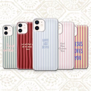 May include: Five smartphone cases featuring vertical stripes in various colors including light blue, dark red, light pink, and yellow. Each case displays unique religious text such as God with us, Let all that you do be done in love, Love like Jesus, God Has Chosen You, and Jesus Loves You.