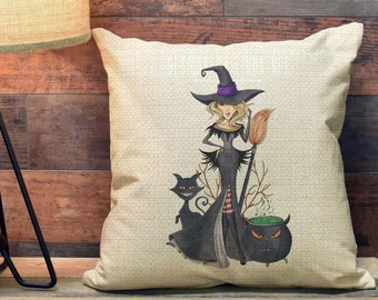 May include: A 18-inch by 18-inch linen pillow case with a Halloween theme. The pillow case features a witch with a black dress, a black cat, and a cauldron. The background is a woodgrain pattern.