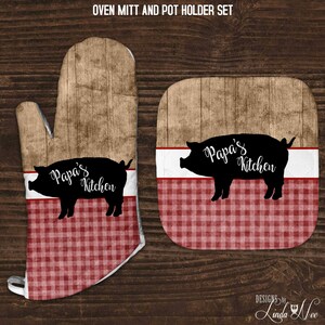 May include: A set of oven mitts and pot holders with a red and white checked pattern. The mitts and holders feature a black silhouette of a pig with the text "Papa's Kitchen" on it.