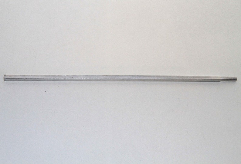 May include: A silver metal rod with a threaded end.
