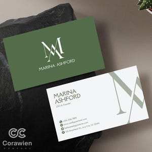 May include: Two rectangular business cards featuring a white and olive green color scheme. One card is olive green with a white monogram logo and the name Marina Ashford. The other is white with the name, title, and contact details in olive green.