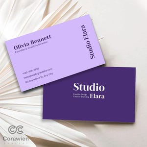 May include: Two rectangular business cards. The top card is light purple with dark purple text reading Olivia Bennett, Founder & Creative Director, Studio Elara, and contact details. The bottom card is dark purple with white text reading Studio Elara.